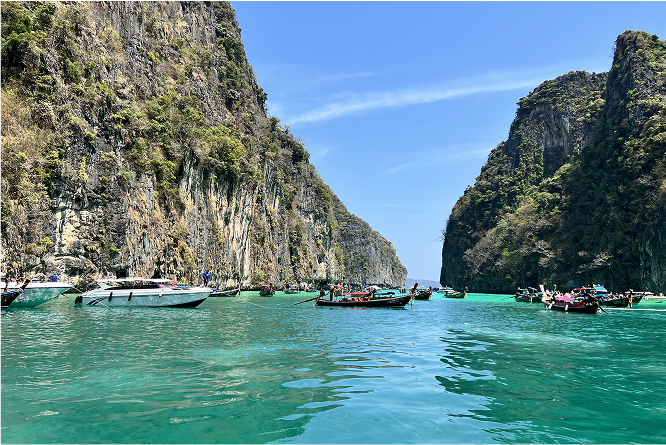 Boats floating in the ocean in Krabi, Thailand